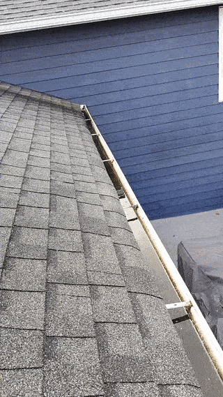 A gutter with standing water due to improper slope