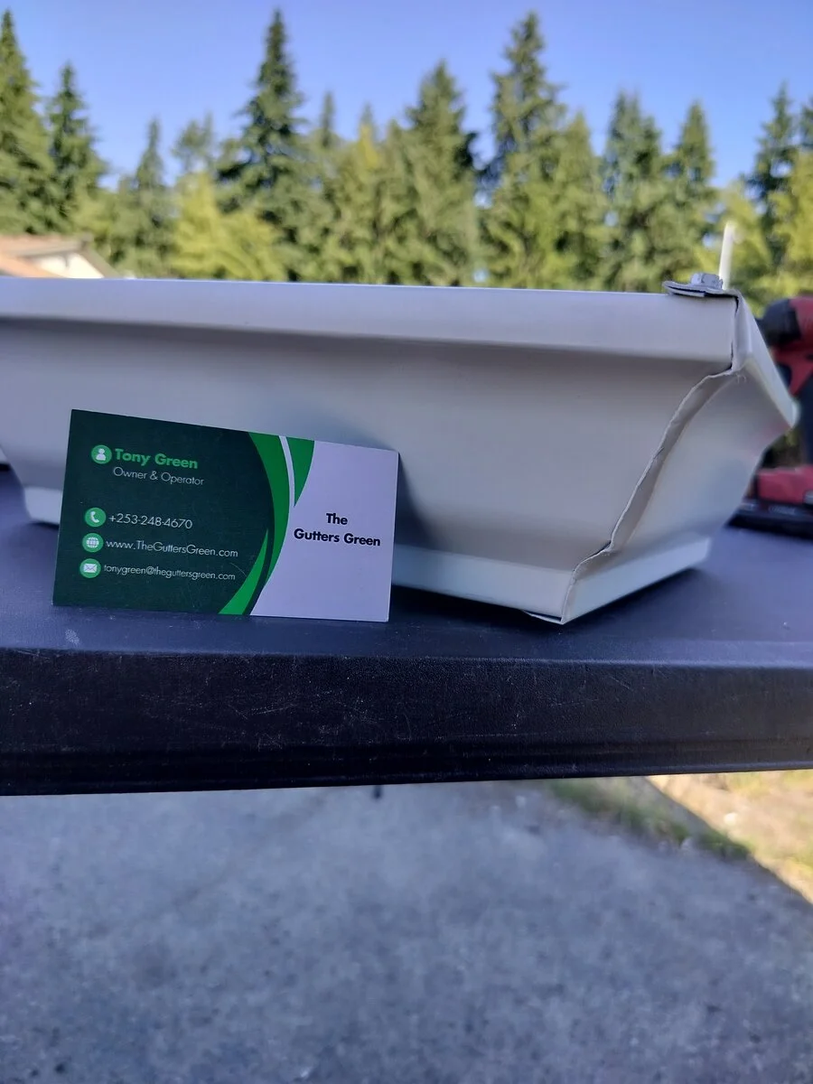 A hand cut miter corner on a gutter